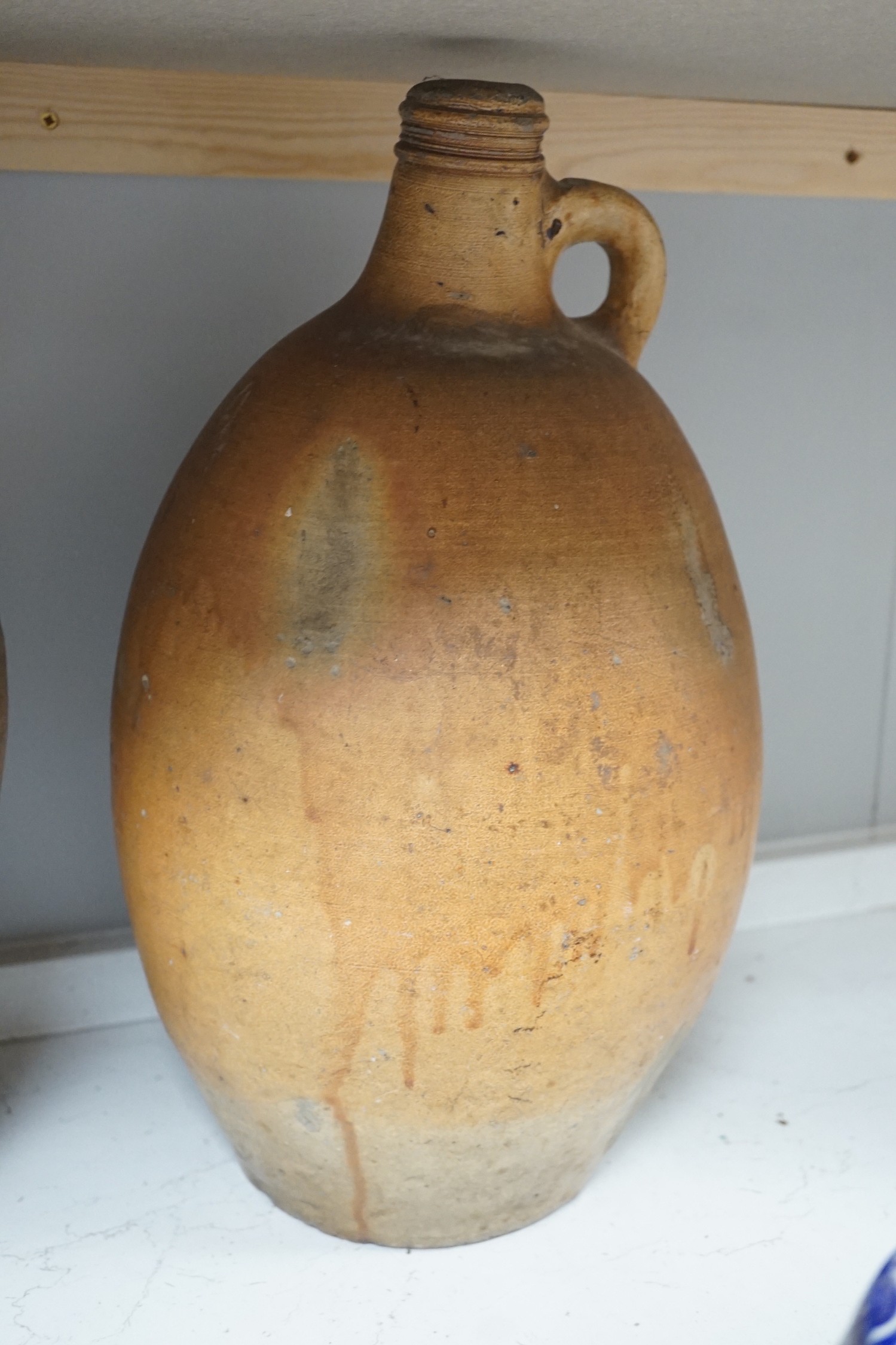Two 19th century salt glazed stoneware flagons, tallest 44cm